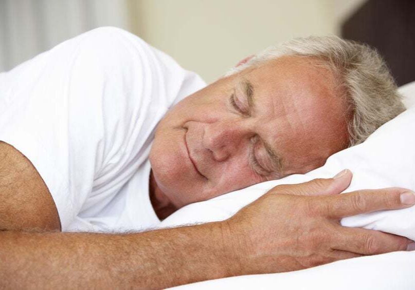 42400839 - senior man asleep in bed